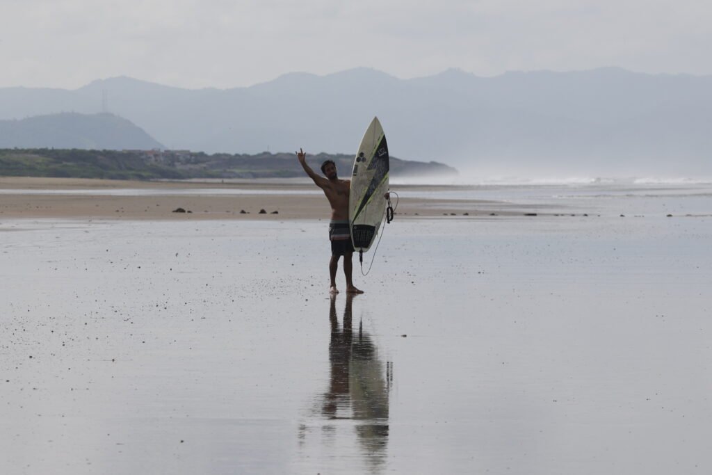 Surfer happy after a surf session in Manta, Ecuador