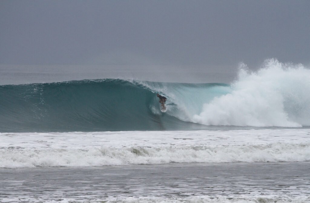 Surfer in a perfect barrel at Manabi beach break