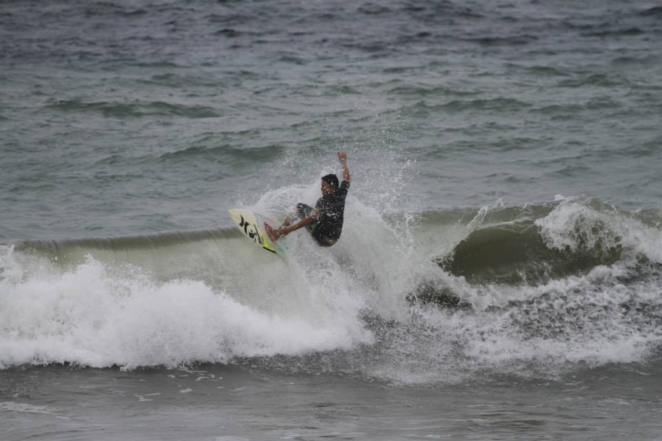 Surfer on wave during a windy day at Manta, Ecuador